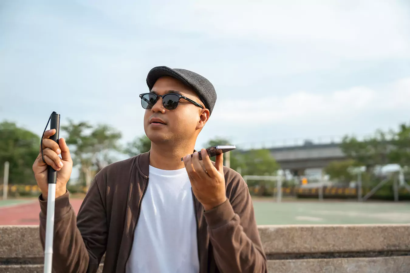 A disabled man talking to someone in the phone